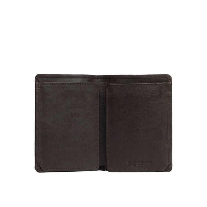 Close-up shot of a man's brown leather bi-fold wallet, open to reveal its empty inner compartments.