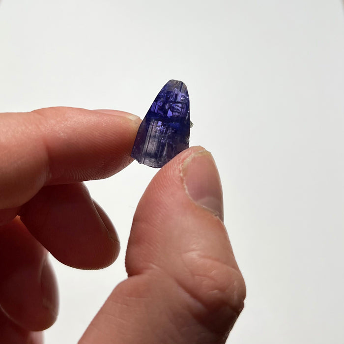 hand with tanzanite crystal