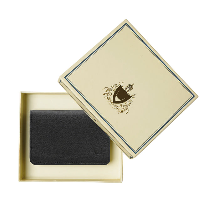Black leather bifold wallet neatly placed in branded gift box with decorative crest logo lid on top.
