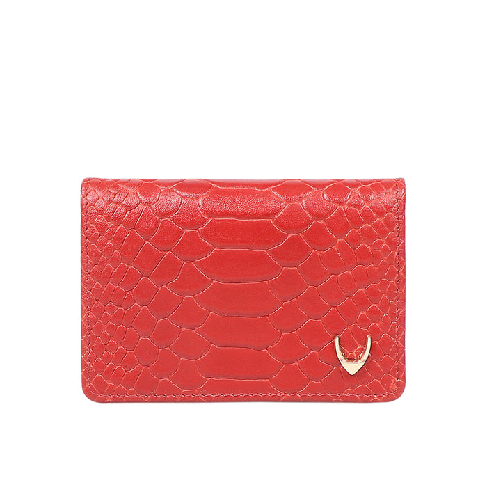 Red textured leather card holder with a scaled pattern, gold corner logo and compact front profile.